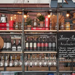 Interior view of Zizzi Leith, bright, open dining with colourful seating and large windows.