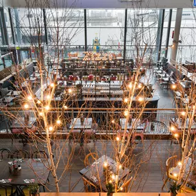 Interior view of Zizzi Leith, bright, open dining with colourful seating and large windows.
