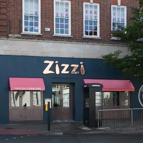Modern Zizzi Sutton exterior with large glass windows and bold signage.