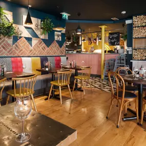 Stylish Zizzi Sutton interior with warm lighting and vibrant décor.