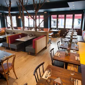 Stylish Zizzi Sutton interior with warm lighting and vibrant décor.