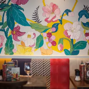 Stylish Zizzi Sutton interior with warm lighting and vibrant décor.