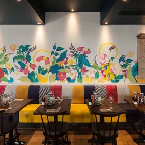 Stylish Zizzi Sutton interior with warm lighting and vibrant décor.