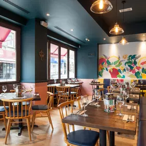 Stylish Zizzi Sutton interior with warm lighting and vibrant décor.