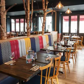 Stylish Zizzi Sutton interior with warm lighting and vibrant décor.