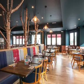 Stylish Zizzi Sutton interior with warm lighting and vibrant décor.