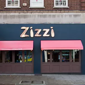 Modern Zizzi Sutton exterior with large glass windows and bold signage.