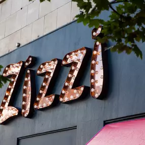 Modern Zizzi Sutton exterior with large glass windows and bold signage.