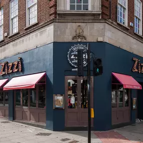 Modern Zizzi Sutton exterior with large glass windows and bold signage.