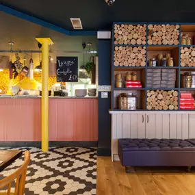 Stylish Zizzi Sutton interior with warm lighting and vibrant décor.