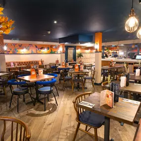 Warm Zizzi Stratford-upon-Avon interior mixing rustic charm and modern flair.