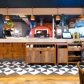 Warm Zizzi Stratford-upon-Avon interior mixing rustic charm and modern flair.