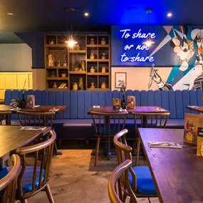 Warm Zizzi Stratford-upon-Avon interior mixing rustic charm and modern flair.