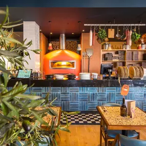 Stylish dining area at Zizzi South Woodford with modern decor and natural accents.