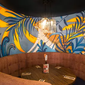 Stylish dining area at Zizzi South Woodford with modern decor and natural accents.