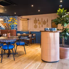 Stylish dining area at Zizzi South Woodford with modern decor and natural accents.