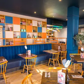 Stylish dining area at Zizzi South Woodford with modern decor and natural accents.
