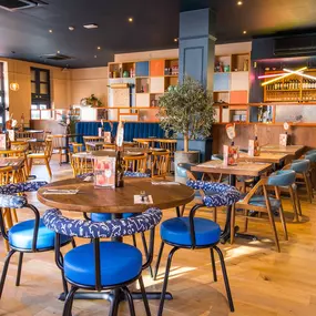 Stylish dining area at Zizzi South Woodford with modern decor and natural accents.