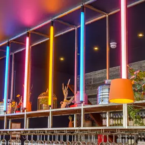 Zizzi Gloucester Quays, colourful mural wall and signature indoor tree feature.