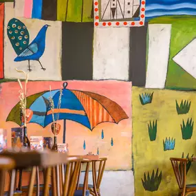Zizzi Gloucester Quays, colourful mural wall and signature indoor tree feature.