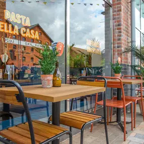 Zizzi Gloucester Quays, inviting outdoor seating along the Quays’ riverside walk.