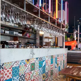 Zizzi Gloucester Quays, colourful mural wall and signature indoor tree feature.