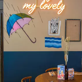 Zizzi Gloucester Quays, colourful mural wall and signature indoor tree feature.