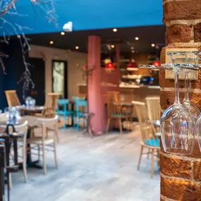 Zizzi Norwich, colourful mural wall and mixed seating styles.