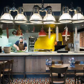 Zizzi Norwich, colourful mural wall and mixed seating styles.