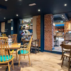 Zizzi Norwich, colourful mural wall and mixed seating styles.