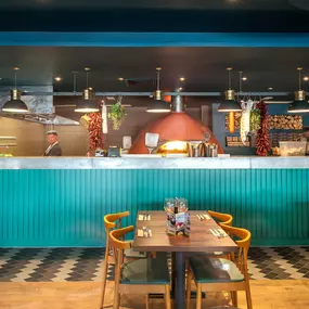 Stylish nautical-themed Zizzi Port Solent interior with warm lighting and wood finishes.