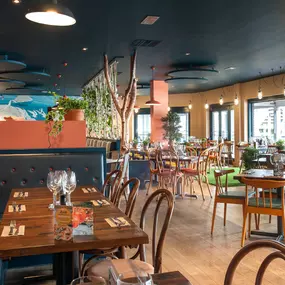 Stylish nautical-themed Zizzi Port Solent interior with warm lighting and wood finishes.