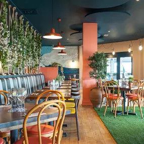 Stylish nautical-themed Zizzi Port Solent interior with warm lighting and wood finishes.