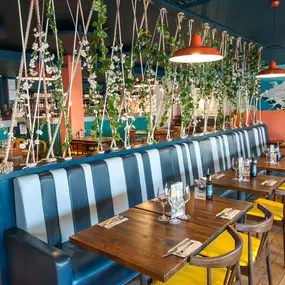 Stylish nautical-themed Zizzi Port Solent interior with warm lighting and wood finishes.