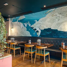 Stylish nautical-themed Zizzi Port Solent interior with warm lighting and wood finishes.