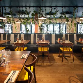 Stylish nautical-themed Zizzi Port Solent interior with warm lighting and wood finishes.