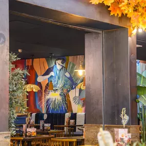 Interior view of Zizzi Sheffield Meadowhall's vibrant modern dining area at with rustic decor and natural accents.