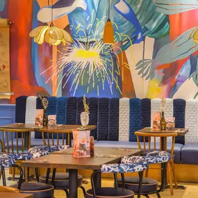 Interior view of Zizzi Sheffield Meadowhall's vibrant modern dining area at with rustic decor and natural accents.