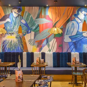 Interior view of Zizzi Sheffield Meadowhall's vibrant modern dining area at with rustic decor and natural accents.
