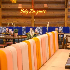 Interior view of Zizzi Sheffield Meadowhall's vibrant modern dining area at with rustic decor and natural accents.