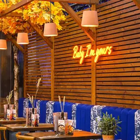 Interior view of Zizzi Sheffield Meadowhall's vibrant modern dining area at with rustic decor and natural accents.
