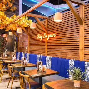Interior view of Zizzi Sheffield Meadowhall's vibrant modern dining area at with rustic decor and natural accents.