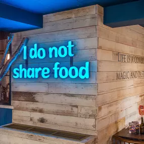 Zizzi Hereford, neon sign saying 'I do not share food'.