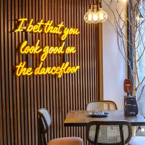 Interior view of Zizzi Sheffield Leopold Square's modern decor and rustic style accents.