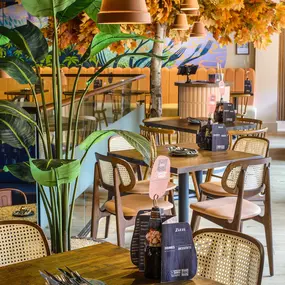 Interior view of Zizzi Sheffield Leopold Square's modern decor and rustic style accents.