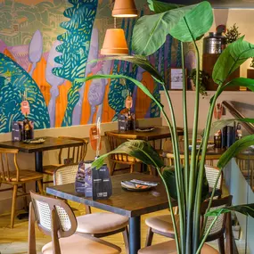 Interior view of Zizzi Sheffield Leopold Square's modern decor and rustic style accents.