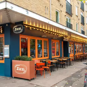 Zizzi Chiswick showcasing the inviting outdoor seating area and restaurant front.