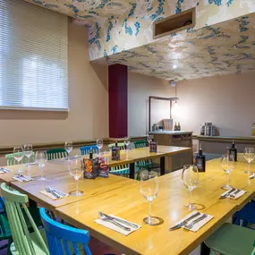 Stylish dining area at Zizzi Cambridge Benedict St with modern decor and natural accents.