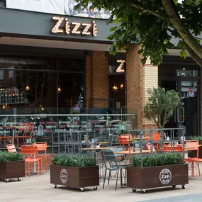 Zizzi Coventry, modern restaurant front with outdoor dining.