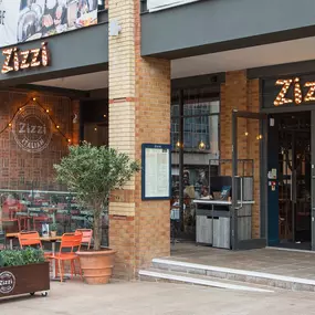 Zizzi Coventry, modern restaurant front with outdoor dining.